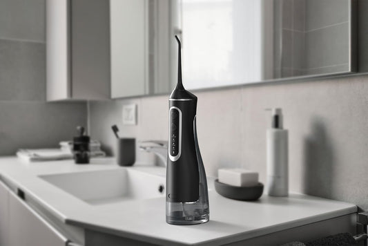 AquaSmil™ | Bærbar vandflosser med 4 tilstande og 5 mundstykker